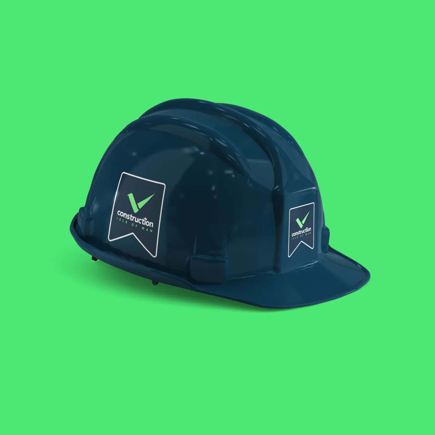 A navy hard hat with the Construction Isle of Man logo sticker, part of the brand identity designed by DotPerformance for the Isle of Man construction industry body